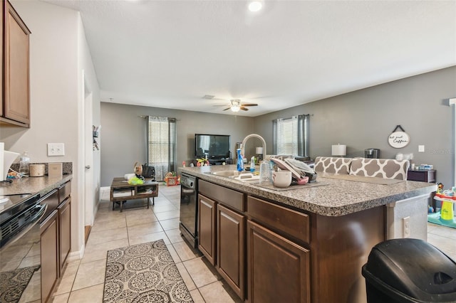 kitchen featuring light tile patterned floors, open floor plan, ceiling fan, and black appliances