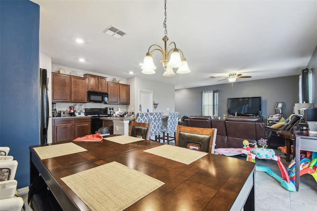 dining room featuring recessed lighting, visible vents, and ceiling fan with notable chandelier