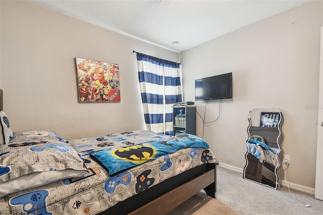 bedroom with baseboards and carpet flooring
