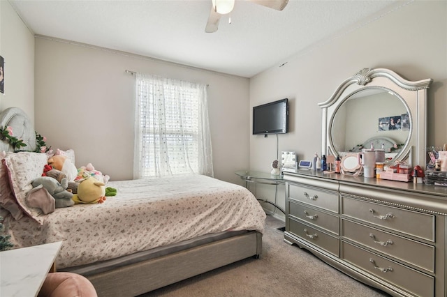 carpeted bedroom with a ceiling fan