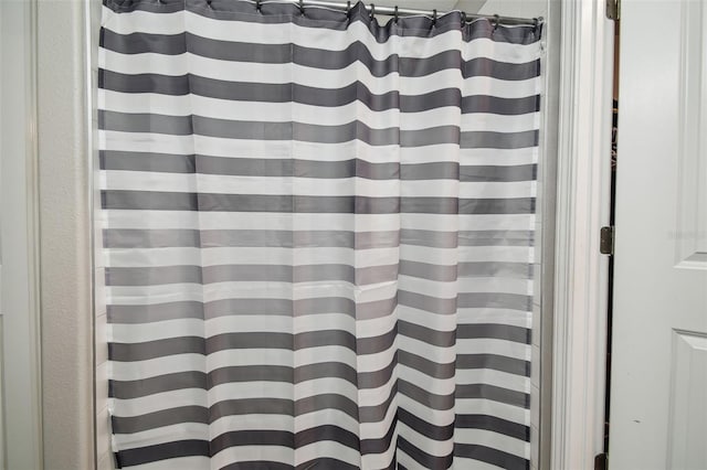 bathroom with a shower with curtain