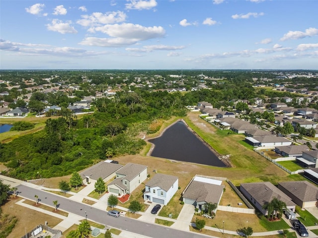 aerial view with a water view and a residential view