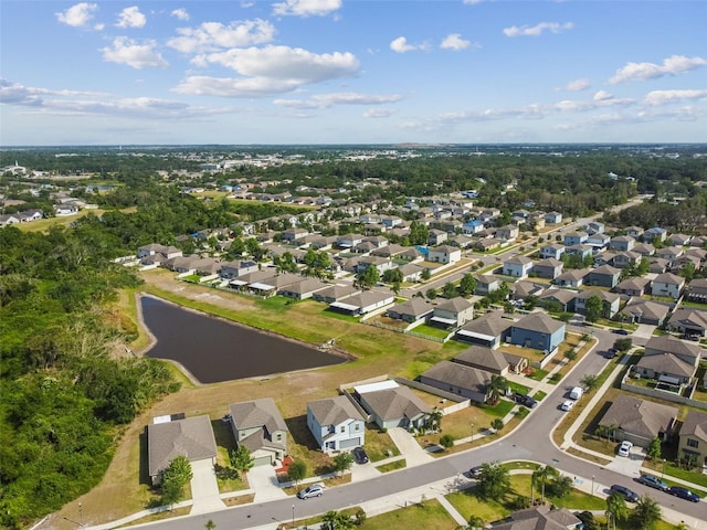 birds eye view of property with a residential view and a water view