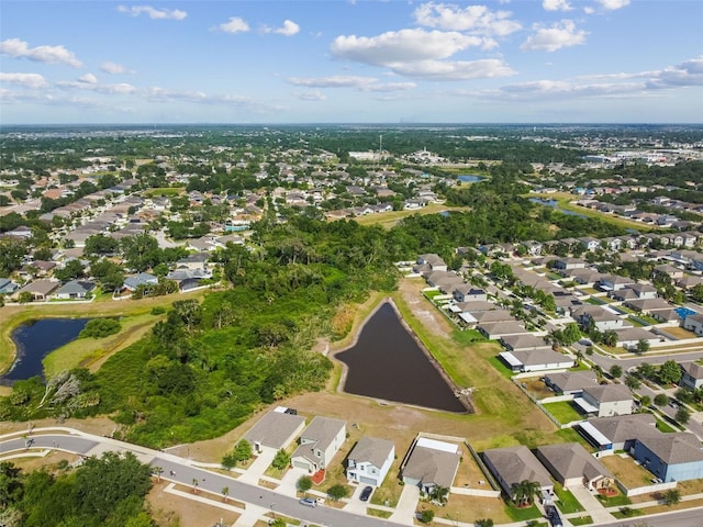 birds eye view of property featuring a residential view and a water view