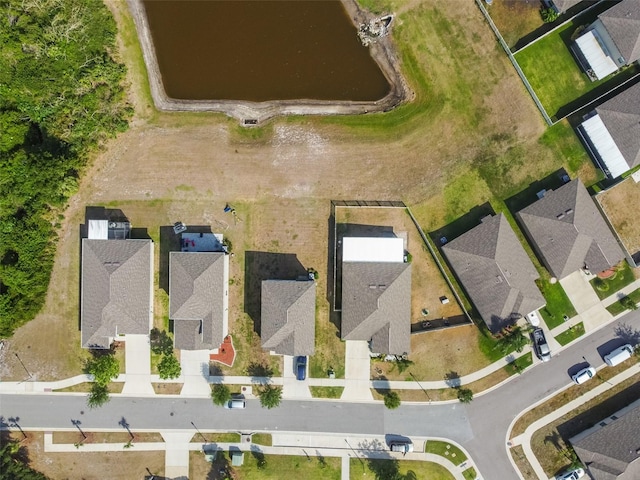 birds eye view of property with a residential view