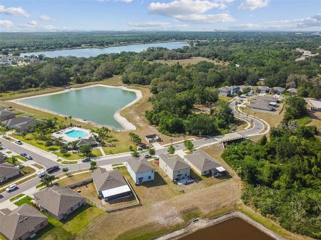 bird's eye view with a water view, a residential view, and a wooded view