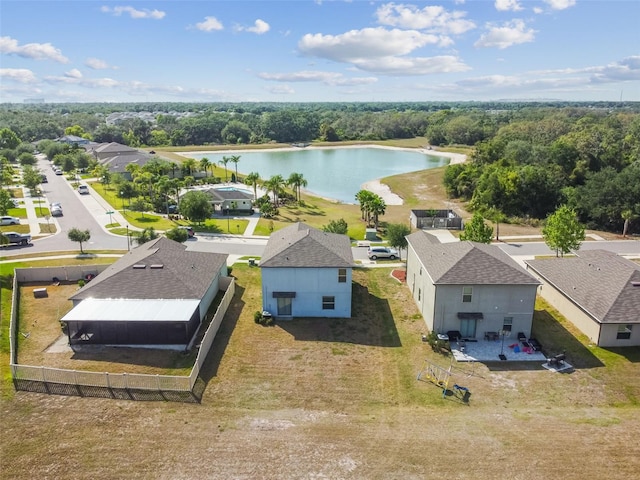 drone / aerial view featuring a water view and a residential view