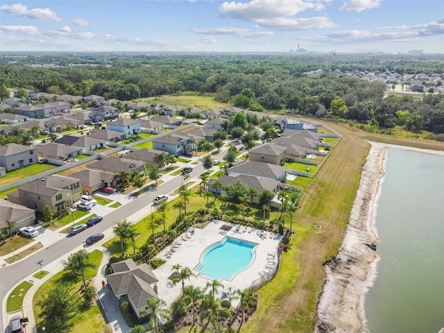 bird's eye view featuring a water view and a residential view
