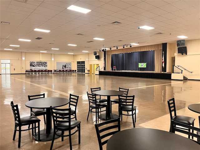 dining space with a paneled ceiling and visible vents