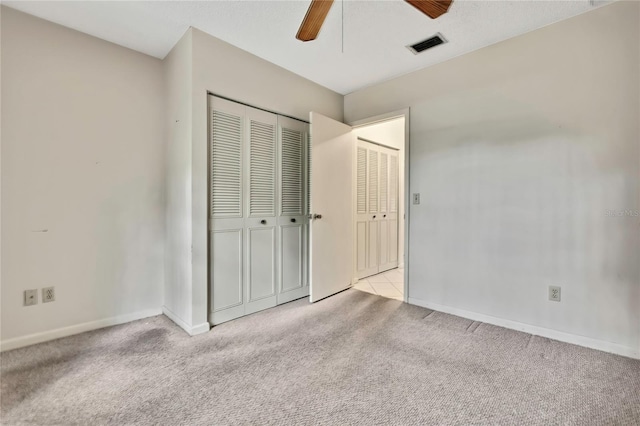 14615 Daybreak Dr, Lutz, FL 33559 - unfurnished bedroom featuring carpet, a closet, and a ceiling fan