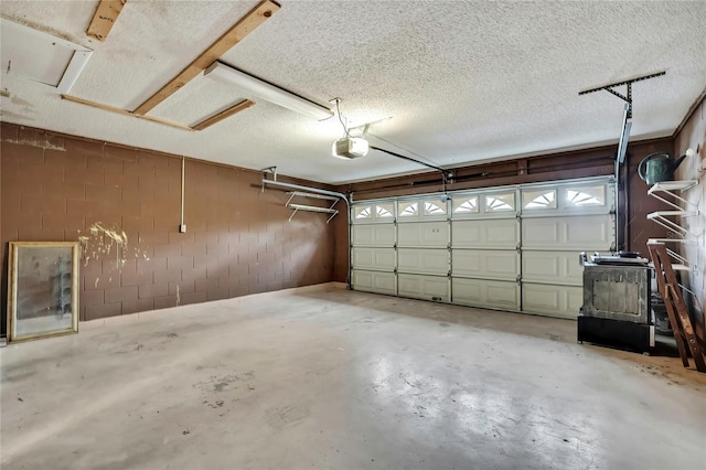 14615 Daybreak Dr, Lutz, FL 33559 - garage with a garage door opener and concrete block wall