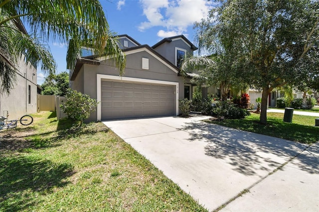 10148 Rose Petal Pl, Riverview, FL 33578 - view of front of house featuring a garage, stucco siding, concrete driveway, and a front lawn