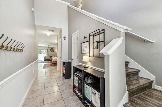 10148 Rose Petal Pl, Riverview, FL 33578 - staircase featuring baseboards, tile patterned flooring, a ceiling fan, and visible vents