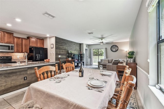 10148 Rose Petal Pl, Riverview, FL 33578 - dining space with visible vents, baseboards, ceiling fan, and light tile patterned floors