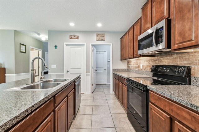 10148 Rose Petal Pl, Riverview, FL 33578 - kitchen with recessed lighting, light tile patterned floors, a sink, appliances with stainless steel finishes, and backsplash