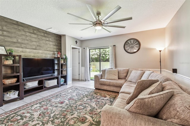 10148 Rose Petal Pl, Riverview, FL 33578 - tiled living room with a ceiling fan, a textured ceiling, and visible vents