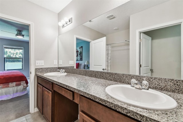 10148 Rose Petal Pl, Riverview, FL 33578 - bathroom with tile patterned floors, a sink, and ensuite bathroom