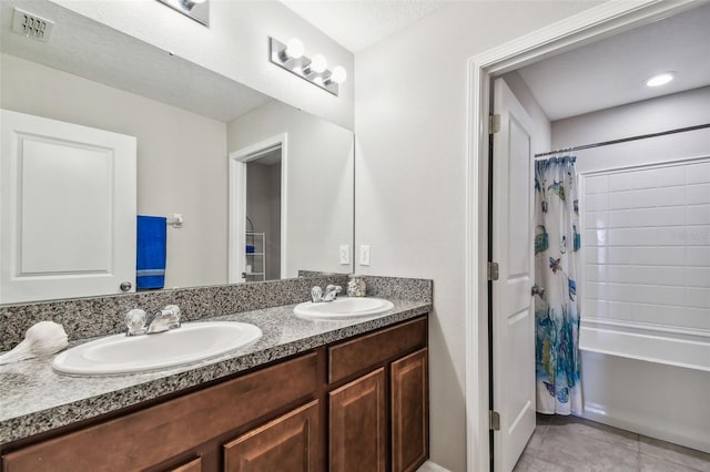 10148 Rose Petal Pl, Riverview, FL 33578 - bathroom featuring visible vents, a sink, tile patterned flooring, and double vanity