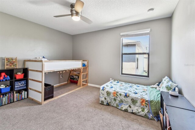 10148 Rose Petal Pl, Riverview, FL 33578 - bedroom with carpet flooring, a textured ceiling, and ceiling fan