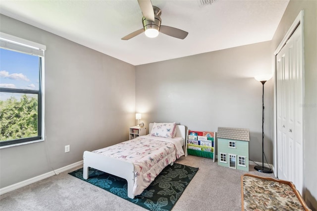 10148 Rose Petal Pl, Riverview, FL 33578 - carpeted bedroom featuring baseboards, multiple windows, ceiling fan, and a closet
