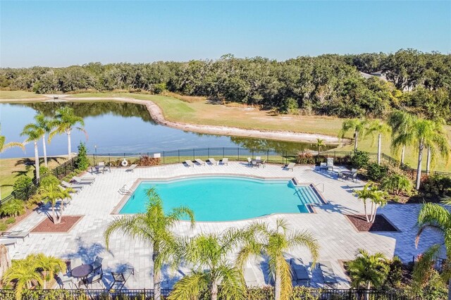 10148 Rose Petal Pl, Riverview, FL 33578 - community pool with a water view, a patio area, and fence