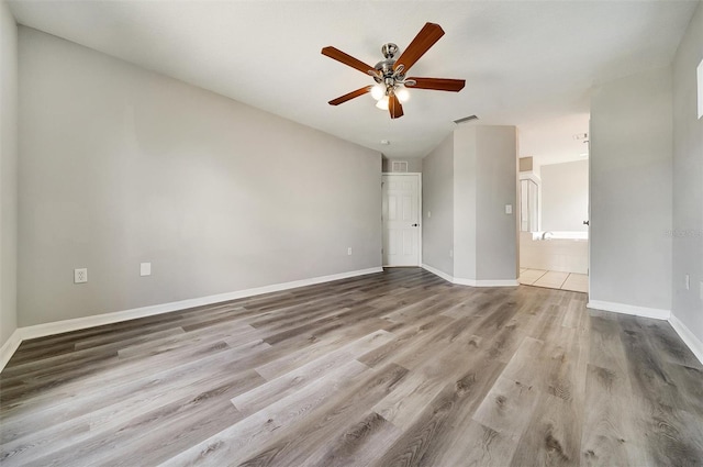 37437 Laurel Hammock Dr, Zephyrhills, FL 33541 - empty room featuring a ceiling fan, baseboards, visible vents, and wood finished floors