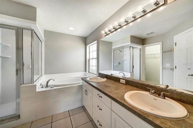 37437 Laurel Hammock Dr, Zephyrhills, FL 33541 - full bathroom with a sink, a walk in closet, a shower stall, and a garden tub