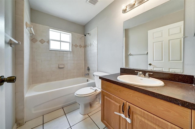 37437 Laurel Hammock Dr, Zephyrhills, FL 33541 - full bath with visible vents, tile patterned flooring, vanity, toilet, and  shower combination