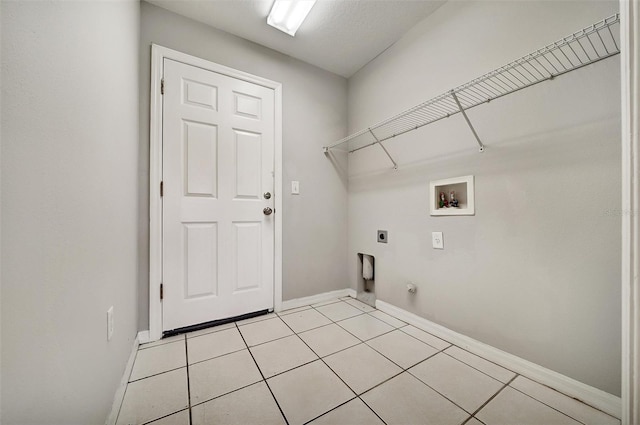 37437 Laurel Hammock Dr, Zephyrhills, FL 33541 - clothes washing area featuring baseboards, electric dryer hookup, washer hookup, and laundry area