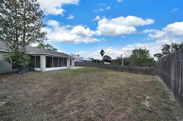 37437 Laurel Hammock Dr, Zephyrhills, FL 33541 - view of yard featuring a sunroom and a fenced backyard