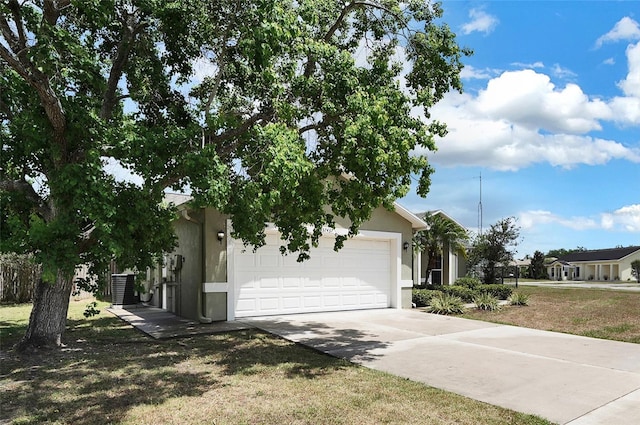 37437 Laurel Hammock Dr, Zephyrhills, FL 33541 - view of front facade featuring an attached garage, concrete driveway, and stucco siding