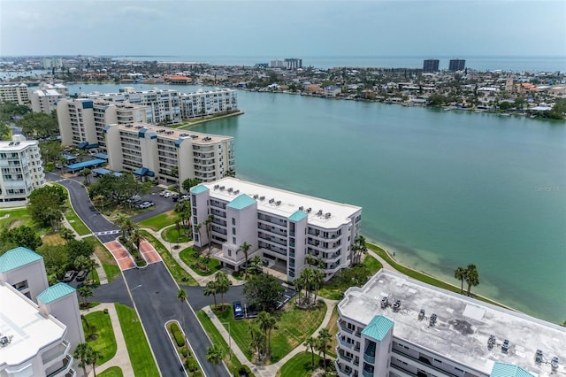 drone / aerial view featuring a city view and a water view