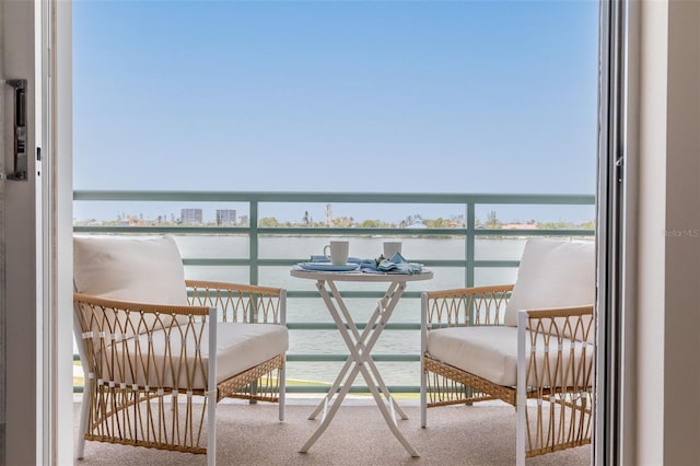 balcony featuring a water view