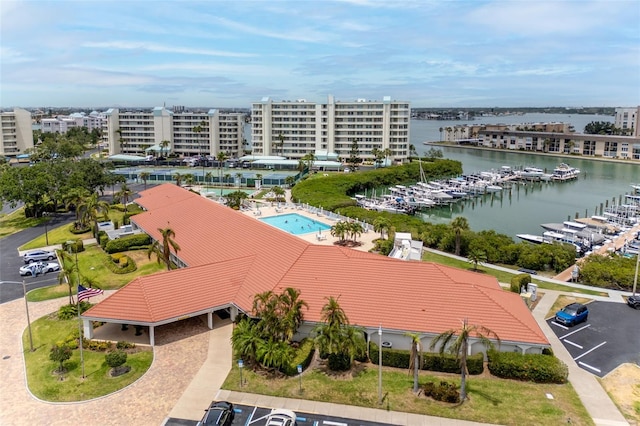 birds eye view of property with a water view
