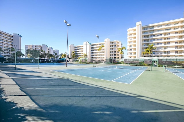 view of sport court with fence