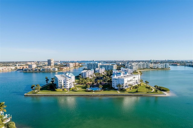 drone / aerial view featuring a water view and a view of city