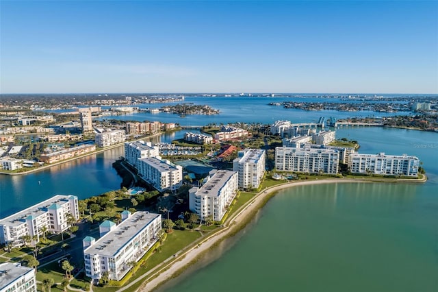 birds eye view of property with a city view and a water view
