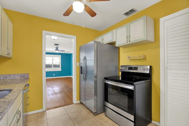 kitchen featuring visible vents, a ceiling fan, appliances with stainless steel finishes, and white cabinets