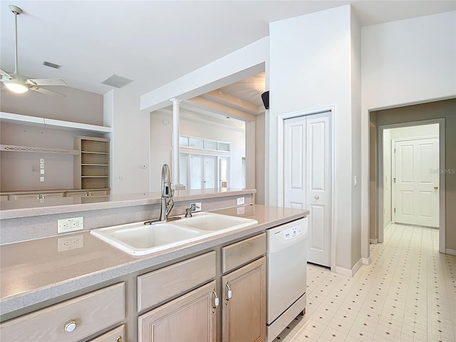 kitchen featuring a sink, light countertops, a ceiling fan, and dishwasher