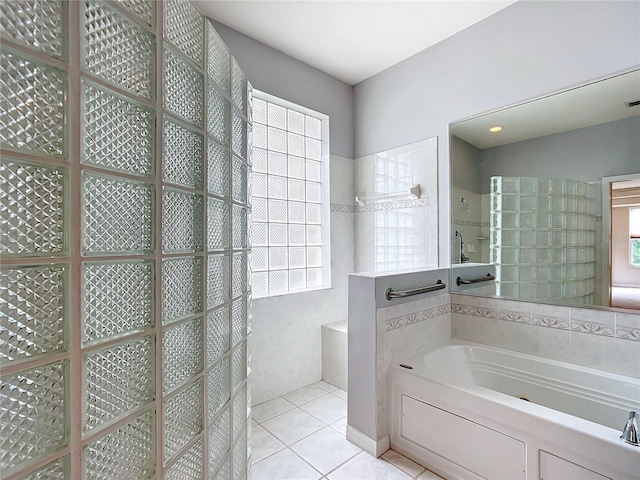 full bath with tile patterned floors, walk in shower, and a bath