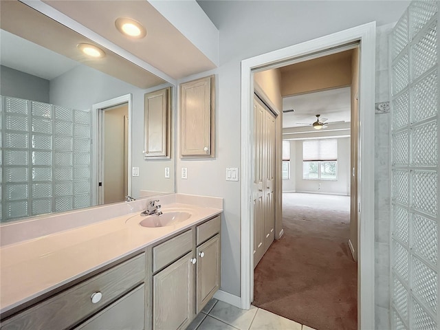 bathroom featuring tile patterned flooring, vanity, baseboards, recessed lighting, and a ceiling fan