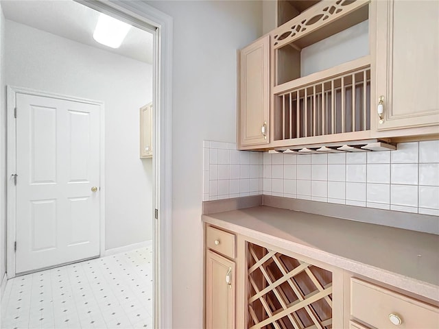 bar featuring baseboards and decorative backsplash