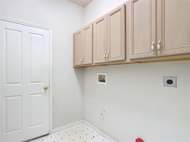 clothes washing area with baseboards, light floors, hookup for an electric dryer, cabinet space, and washer hookup