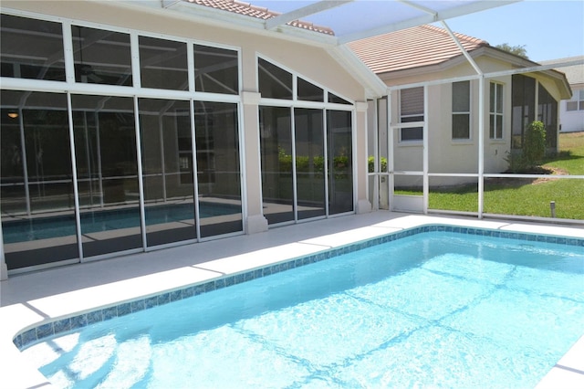 outdoor pool featuring a patio and a lanai