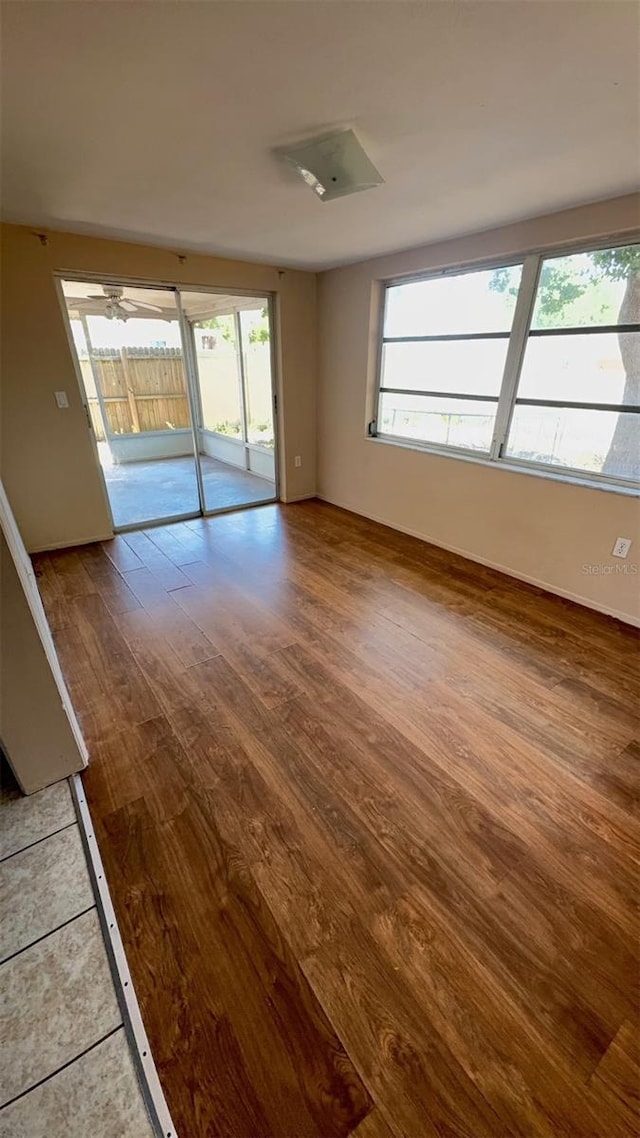 7734 Judith Cres, Port Richey, FL 34668 - spare room featuring wood finished floors and a wealth of natural light