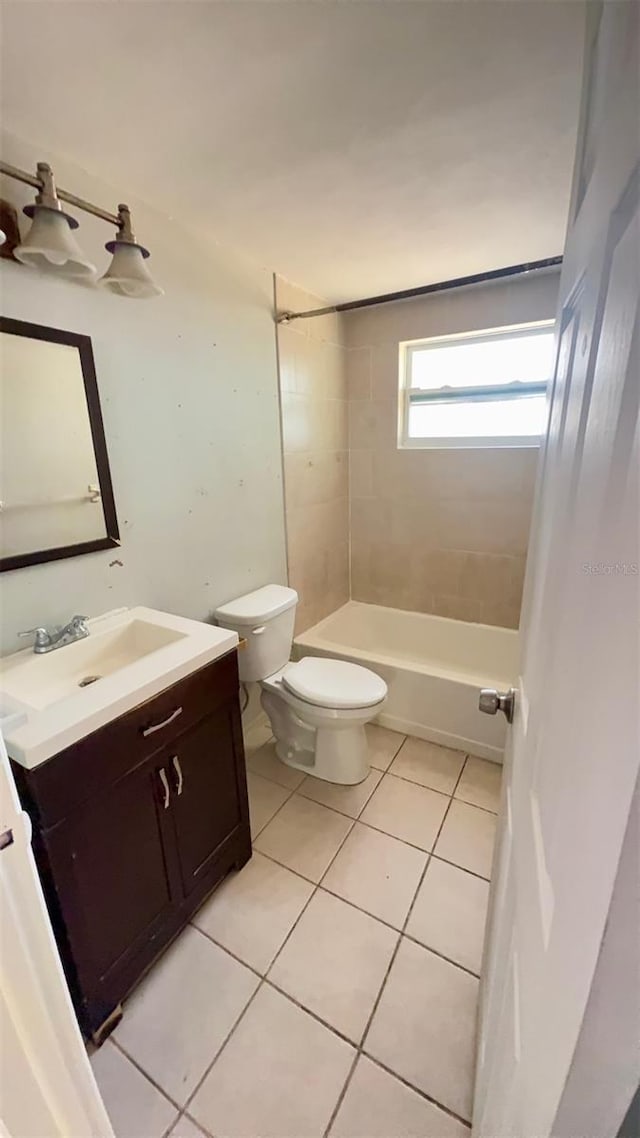 7734 Judith Cres, Port Richey, FL 34668 - bathroom with tile patterned flooring, washtub / shower combination, toilet, and vanity