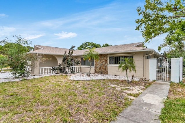1403 Garden Ave, Tarpon Springs, FL 34689 - view of front of property featuring a gate