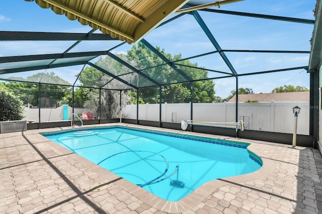 1403 Garden Ave, Tarpon Springs, FL 34689 - view of pool featuring a patio area, glass enclosure, and fence