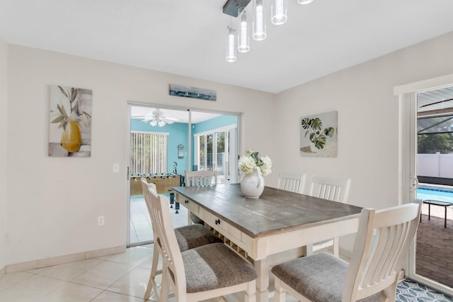 1403 Garden Ave, Tarpon Springs, FL 34689 - dining area with plenty of natural light, light tile patterned flooring, and baseboards