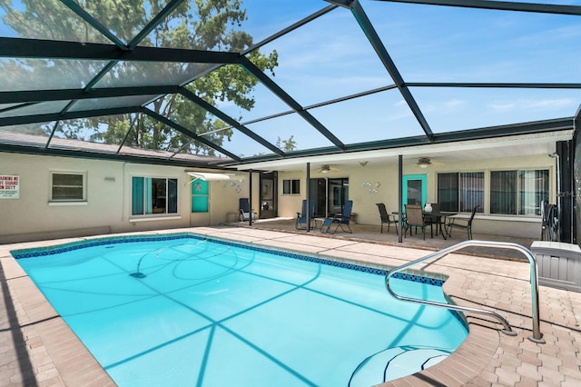 1403 Garden Ave, Tarpon Springs, FL 34689 - outdoor pool with ceiling fan, a patio area, and a lanai